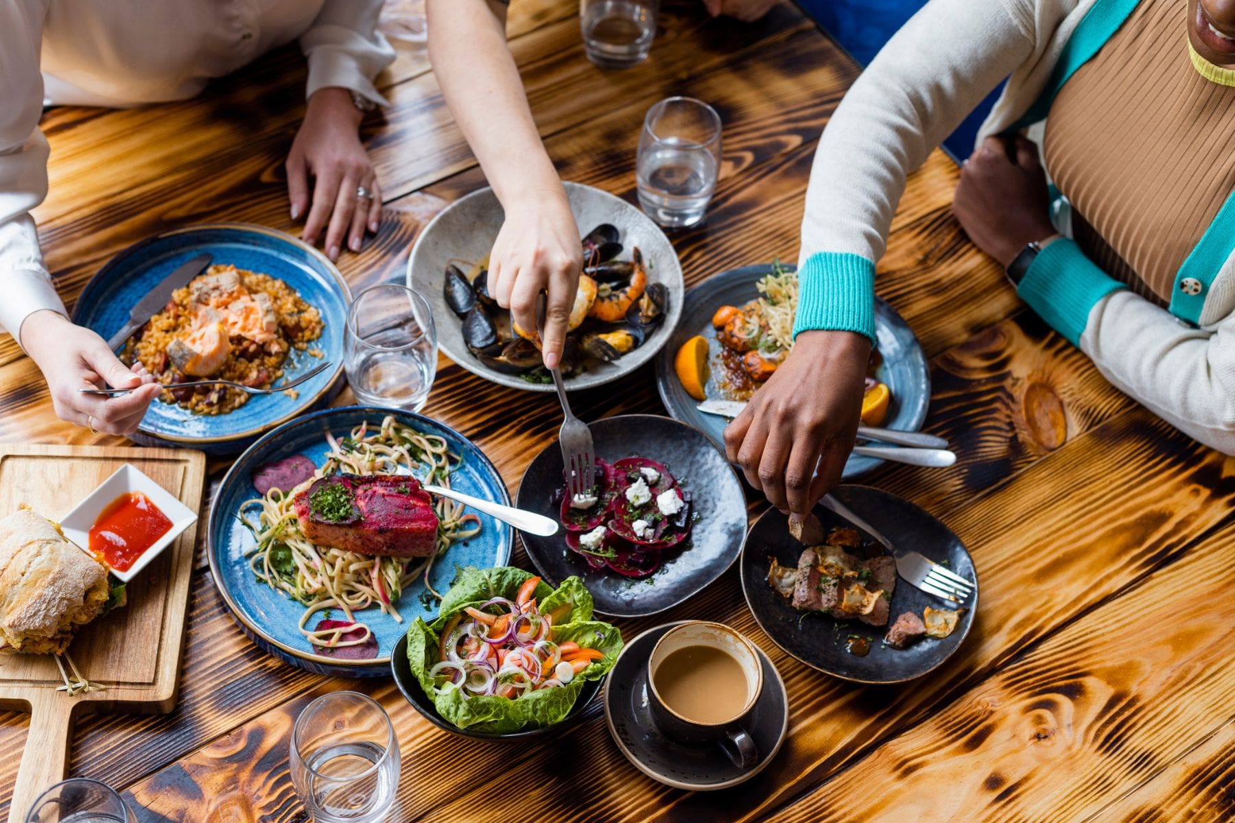 friends sharing food - best restaurants in Bath